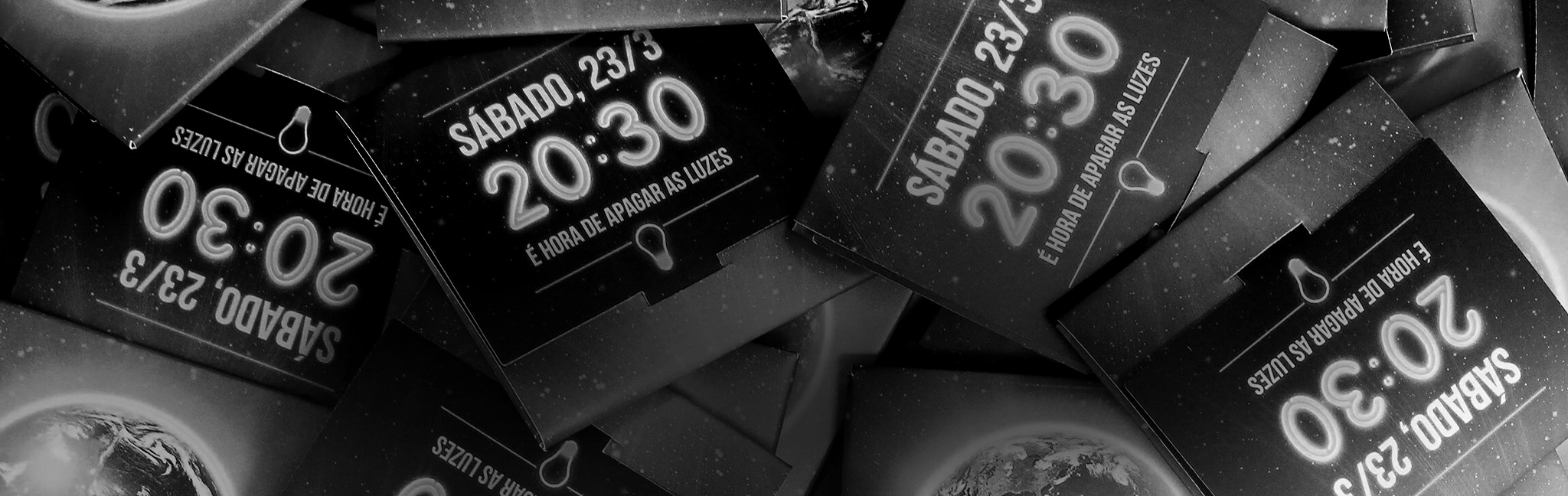 Glow-in-the-dark condom packaging inviting people to turn off the lights for Earth Hour