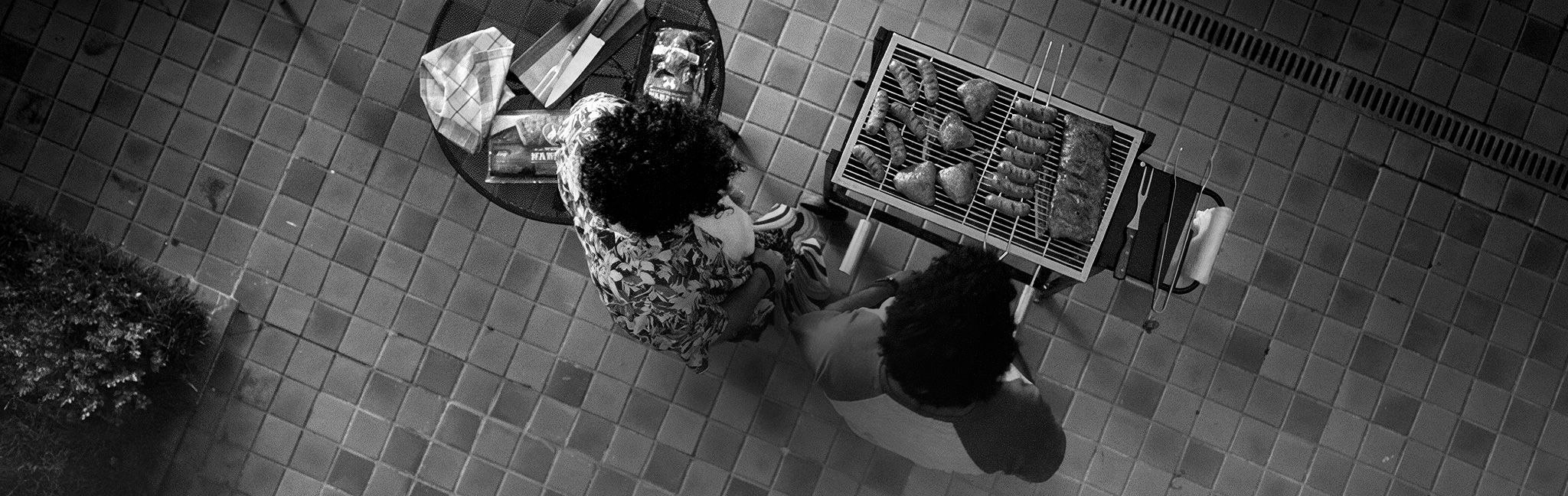 Perdigão Na Brasa sausages sizzling on a barbecue grill