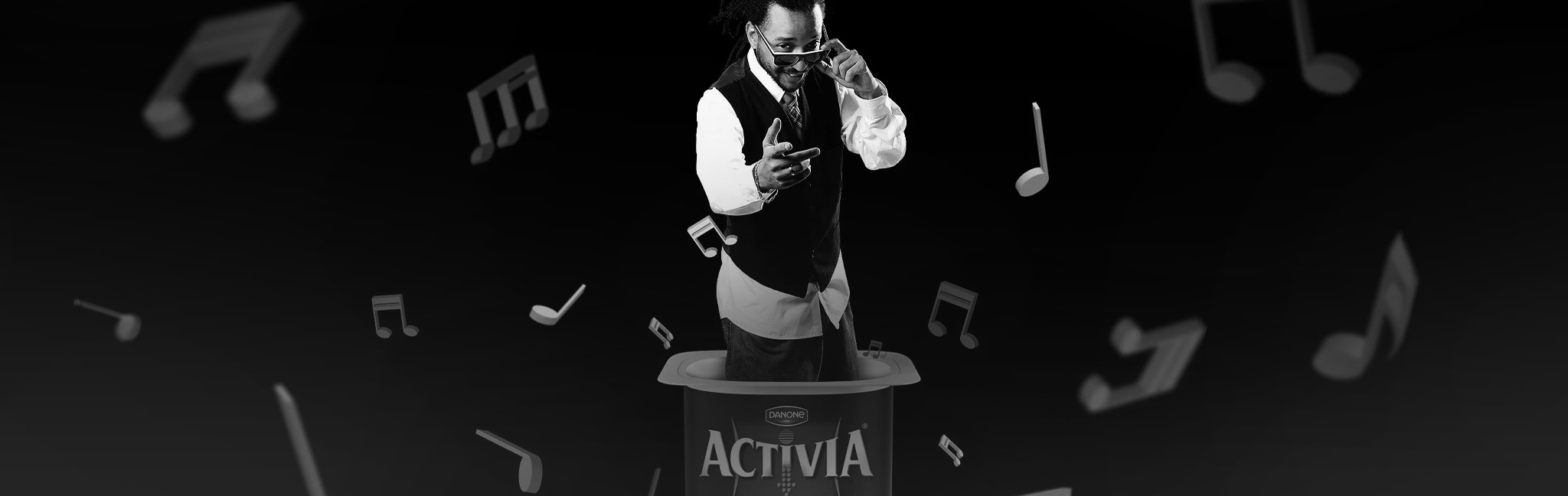 An Activia Rhythm in the Pot musician surrounded by musical notes